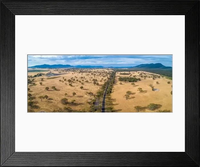 Framed Print : Aerial panorama of Australian outback and rural road with mountains Framed Print : Aerial panorama of Australian outback and rural road with mountains