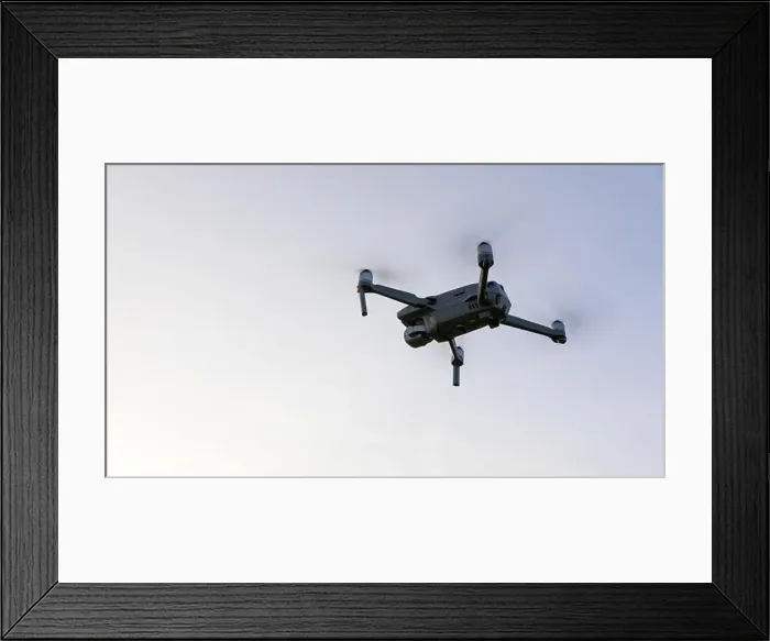 Framed Print : Drone flying over landscape. UAV drone copter flying with digital camera Framed Print : Drone flying over landscape. UAV drone copter flying with digital camera