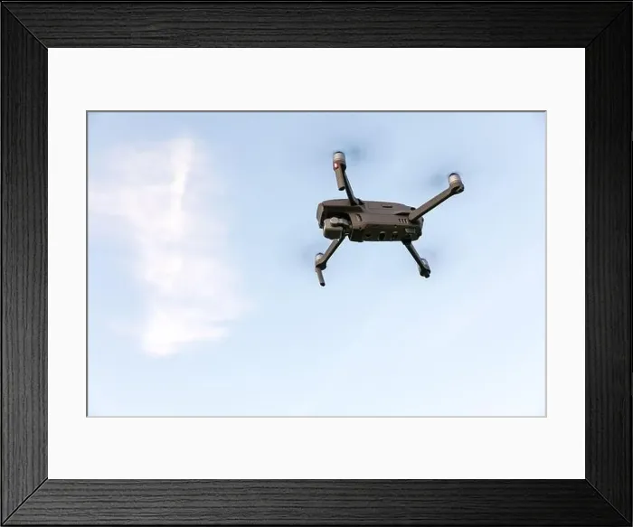 Framed Print : Drone flying over landscape. UAV drone copter flying with digital camera Framed Print : Drone flying over landscape. UAV drone copter flying with digital camera