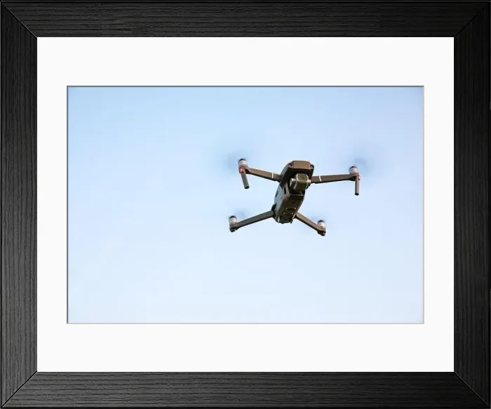 Framed Print : Drone flying over landscape. UAV drone copter flying with digital camera Framed Print : Drone flying over landscape. UAV drone copter flying with digital camera