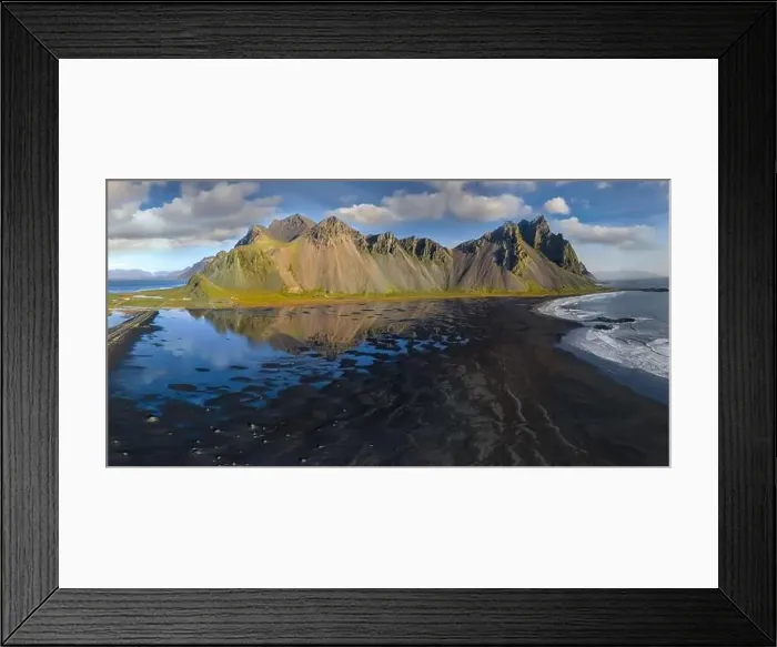 Framed Print : Epic aerial drone view flying over landscape of the black sand beach in Stokksnes on a sunny day Framed Print : Epic aerial drone view flying over landscape of the black sand beach in Stokksnes on a sunny day