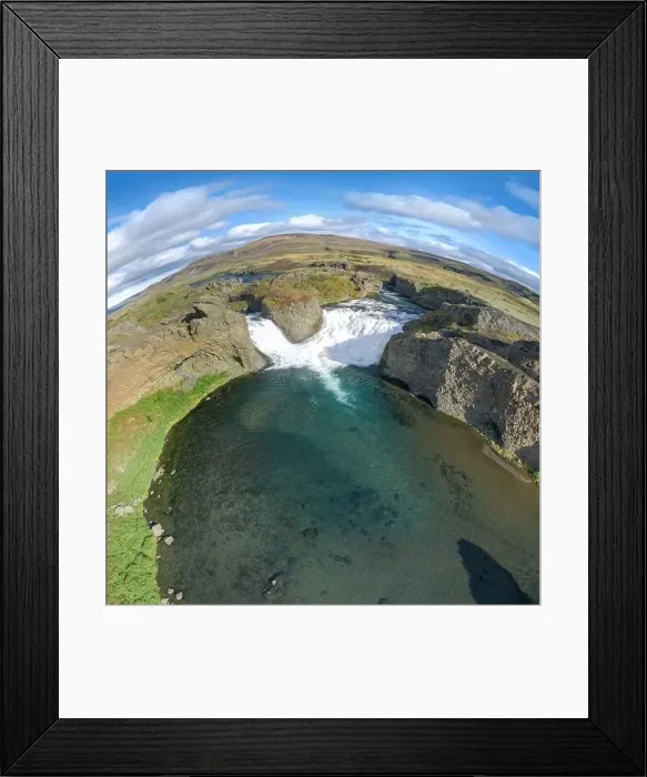 Framed Print : Epic aerial drone view flying over landscape of Hjalparfoss waterfall and lagoon on a sunny day Framed Print : Epic aerial drone view flying over landscape of Hjalparfoss waterfall and lagoon on a sunny day