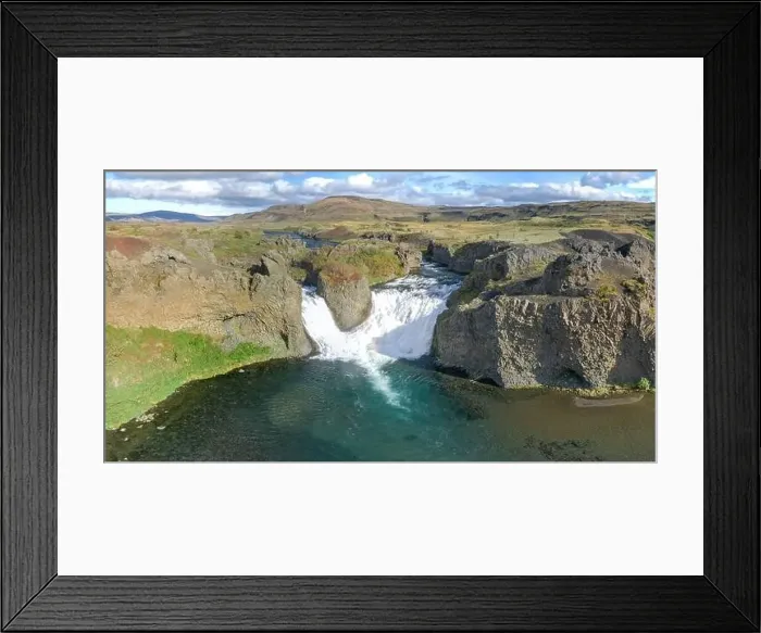 Framed Print : Epic aerial drone view flying over landscape of Hjalparfoss waterfall and lagoon on a sunny day Framed Print : Epic aerial drone view flying over landscape of Hjalparfoss waterfall and lagoon on a sunny day