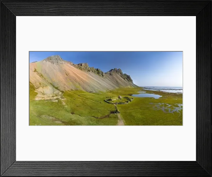 Framed Print : Icelandic aerial landscape with a viking village in Stokksnes. Panorama of Vestrahorn mountain on a sunny day Framed Print : Icelandic aerial landscape with a viking village in Stokksnes. Panorama of Vestrahorn mountain on a sunny day