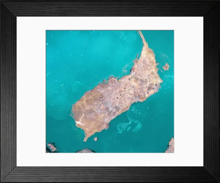Framed Print : A small island with trees without leaves and orange dry vegetation, in the center of Hammers Lake, drone view Framed Print : A small island with trees without leaves and orange dry vegetation, in the center of Hammers Lake, drone view