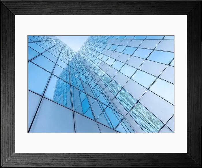 Framed Print : glass facades of modern office buildings and reflection of blue sky Framed Print : glass facades of modern office buildings and reflection of blue sky