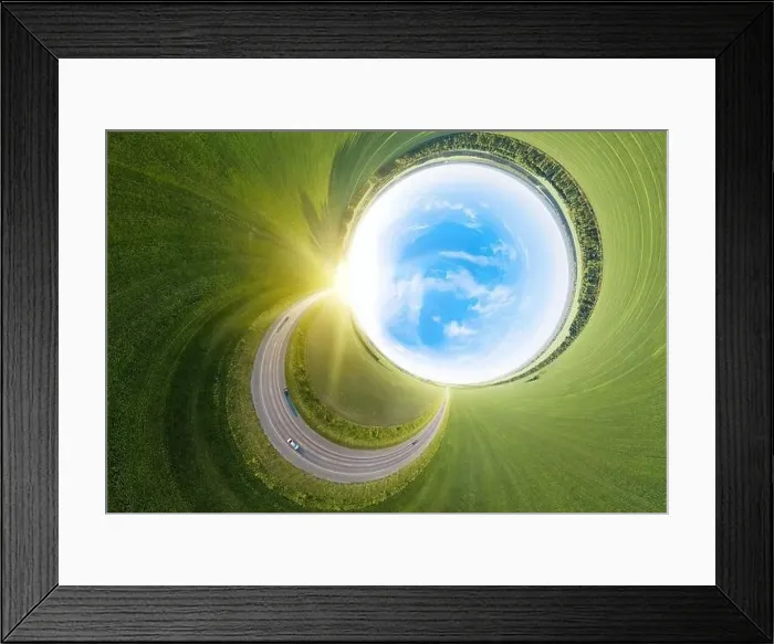 Framed Print : Aerial abstract 360 turned out view of a landscape while traveling by car on a circle asphalt road of a green Framed Print : Aerial abstract 360 turned out view of a landscape while traveling by car on a circle asphalt road of a green