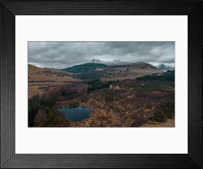 Framed Print : Snowy mountain range in Scottish Highlands at winter - drone point of view Framed Print : Snowy mountain range in Scottish Highlands at winter - drone point of view