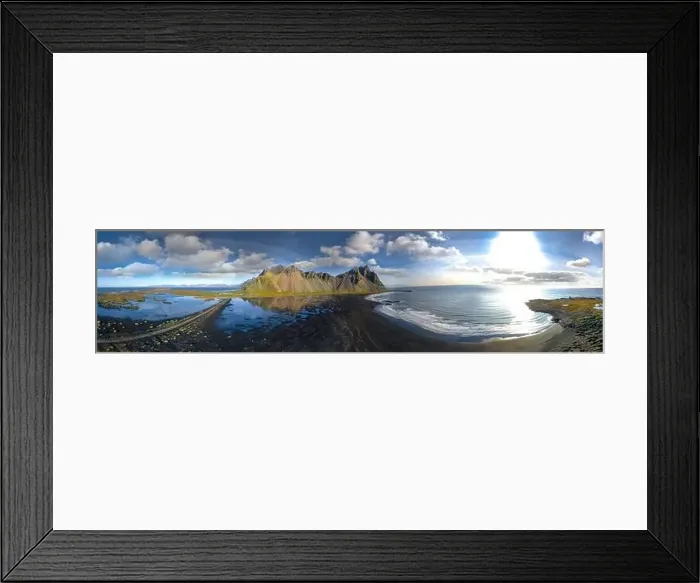 Framed Print : Epic aerial drone view flying over landscape of the black sand beach in Stokksnes on a sunny day