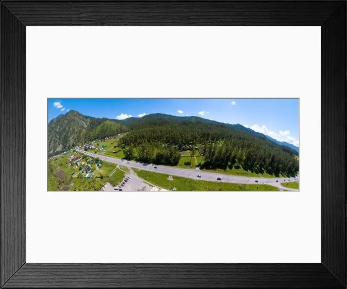 Framed Print : A wide banner aerial view of the direct road with cars in the Altai mountains surrounded by green forest and trees Framed Print : A wide banner aerial view of the direct road with cars in the Altai mountains surrounded by green forest and trees