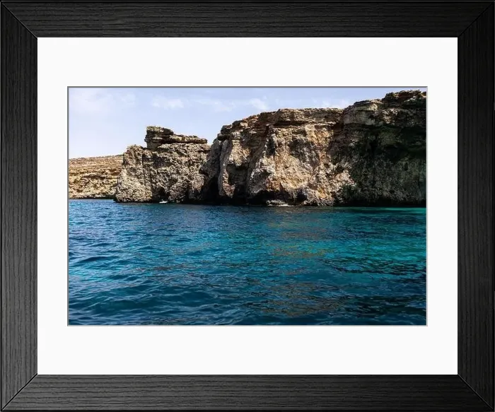 Framed Print : rocks in the sea. Mountain slopes on the background of the sea shore Framed Print : rocks in the sea. Mountain slopes on the background of the sea shore