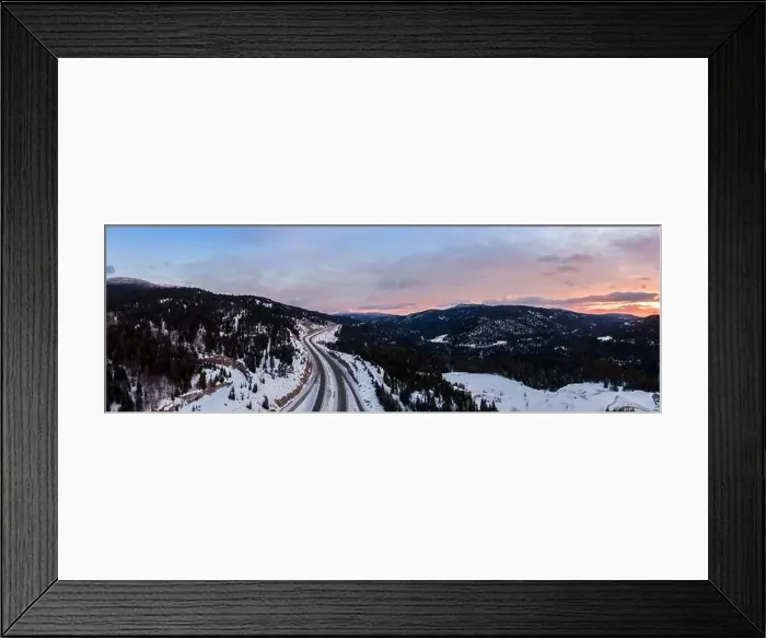Framed Print : Aerial Panoramic View of a scenic Highway passing in the Canadian Mountain Landscape during a colorful winter sunrise Framed Print : Aerial Panoramic View of a scenic Highway passing in the Canadian Mountain Landscape during a colorful winter sunrise