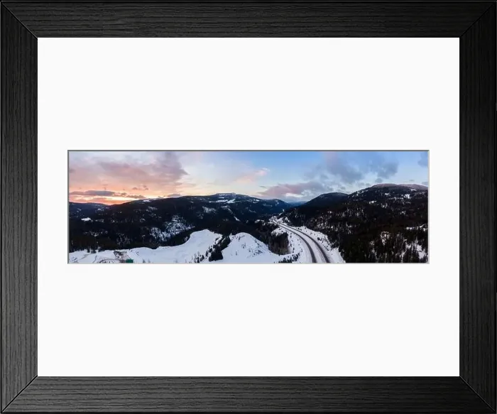 Framed Print : Aerial Panoramic View of a scenic Highway passing in the Canadian Mountain Landscape during a colorful winter sunrise Framed Print : Aerial Panoramic View of a scenic Highway passing in the Canadian Mountain Landscape during a colorful winter sunrise