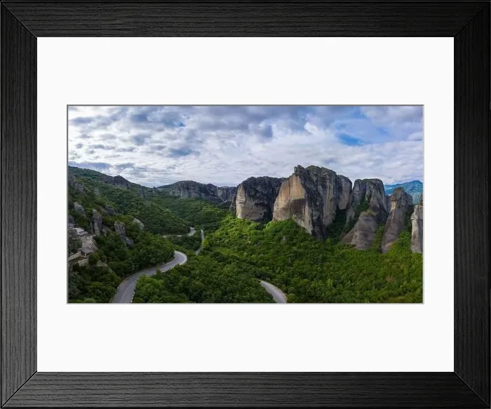 Framed Print : Aerial panorama view of a slide from a drone on a panorama of a mountain range Framed Print : Aerial panorama view of a slide from a drone on a panorama of a mountain range