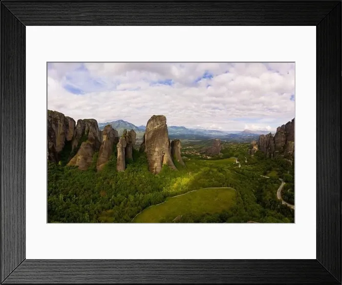 Framed Print : Aerial panorama view of a slide from a drone on a panorama of a mountain range Framed Print : Aerial panorama view of a slide from a drone on a panorama of a mountain range