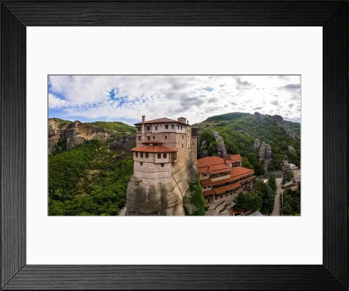 Framed Print : Aerial panorama view of a slide from a drone on a panorama of a mountain range Framed Print : Aerial panorama view of a slide from a drone on a panorama of a mountain range