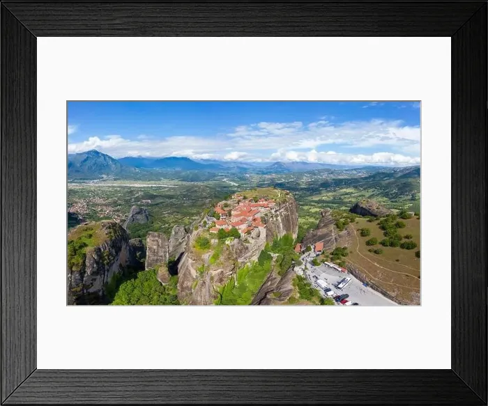 Framed Print : Aerial panorama view of a slide from a drone on a panorama of a mountain range Framed Print : Aerial panorama view of a slide from a drone on a panorama of a mountain range