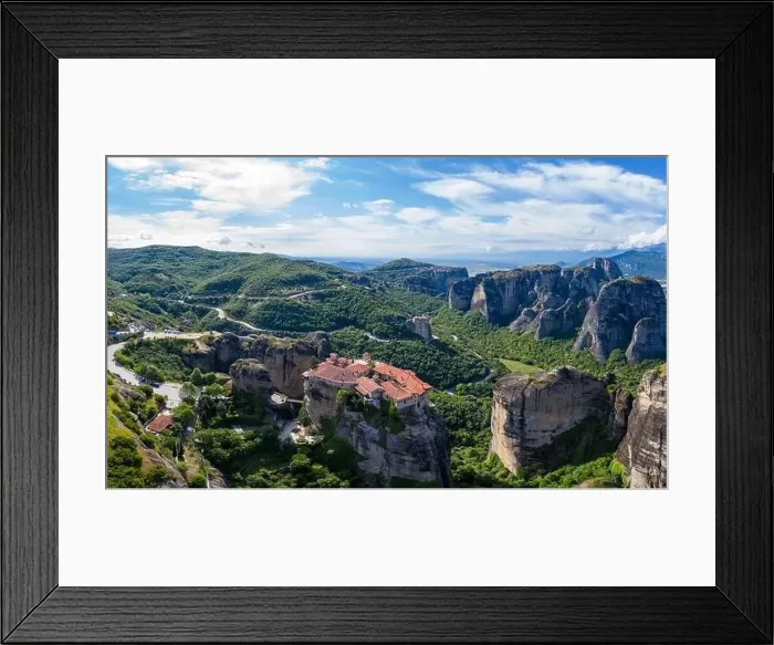 Framed Print : Aerial panorama view of a slide from a drone on a panorama of a mountain range Framed Print : Aerial panorama view of a slide from a drone on a panorama of a mountain range
