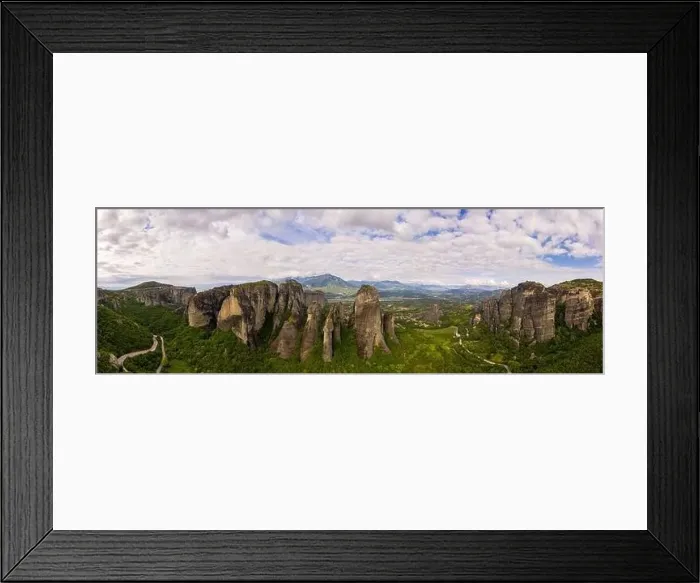 Framed Print : Aerial panorama view of a slide from a drone on a panorama of a mountain range Framed Print : Aerial panorama view of a slide from a drone on a panorama of a mountain range
