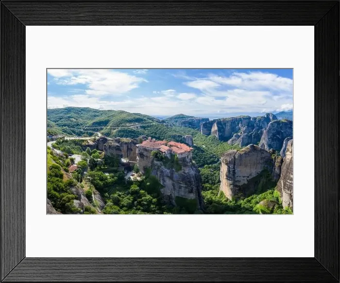Framed Print : Aerial panorama view of a slide from a drone on a panorama of a mountain range Framed Print : Aerial panorama view of a slide from a drone on a panorama of a mountain range