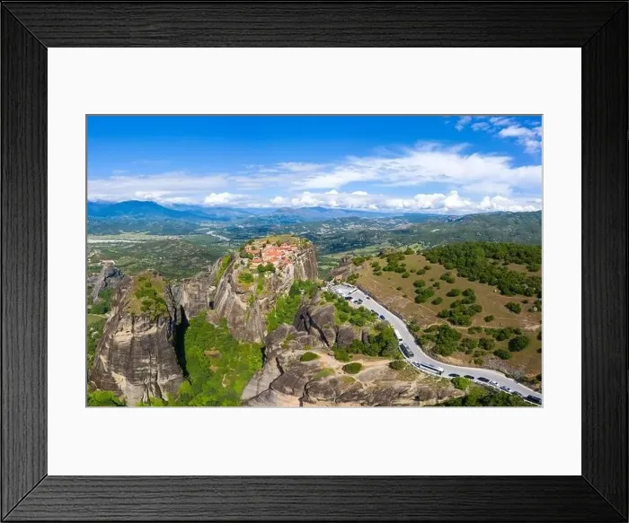 Framed Print : Aerial panorama view of a slide from a drone on a panorama of a mountain range Framed Print : Aerial panorama view of a slide from a drone on a panorama of a mountain range
