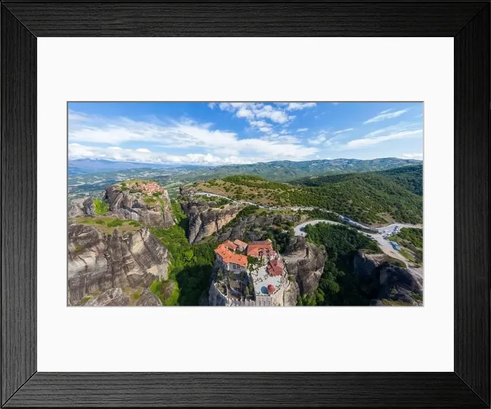 Framed Print : Aerial panorama view of a slide from a drone on a panorama of a mountain range Framed Print : Aerial panorama view of a slide from a drone on a panorama of a mountain range