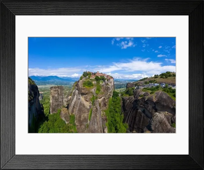 Framed Print : Aerial panorama view of a slide from a drone on a panorama of a mountain range Framed Print : Aerial panorama view of a slide from a drone on a panorama of a mountain range