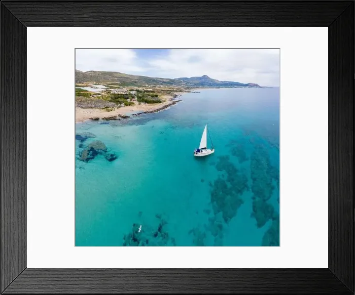 Framed Print : Aerial panoramic drone top view photo of sail boat sailing in mediterranean Aegean island of Crete Greece in summer Framed Print : Aerial panoramic drone top view photo of sail boat sailing in mediterranean Aegean island of Crete Greece in summer