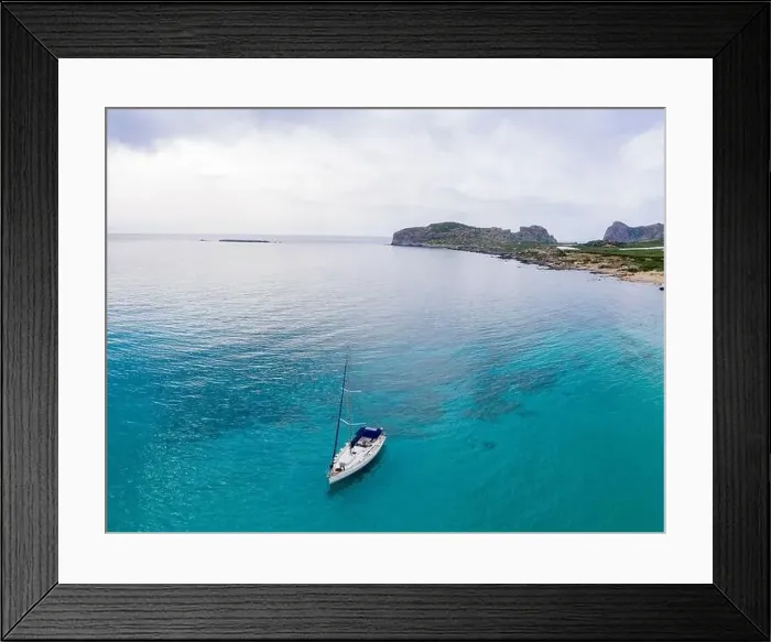 Framed Print : Aerial panoramic drone top view photo of sail boat sailing in mediterranean Aegean island of Crete Greece in summer Framed Print : Aerial panoramic drone top view photo of sail boat sailing in mediterranean Aegean island of Crete Greece in summer