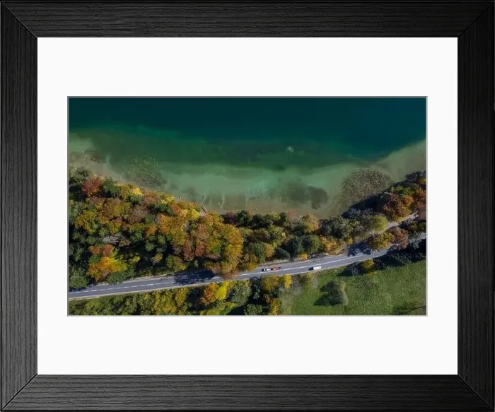 Framed Print : Top View of a beach nearby trees and a road with driving cars in autumn Framed Print : Top View of a beach nearby trees and a road with driving cars in autumn