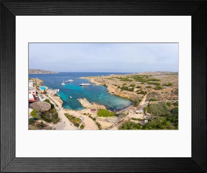 Framed Print : Aerial drone view Comino, Malta Blue Lagoon to enjoy the clear turquoise water with clear blue sky and boats in summer Framed Print : Aerial drone view Comino, Malta Blue Lagoon to enjoy the clear turquoise water with clear blue sky and boats in summer