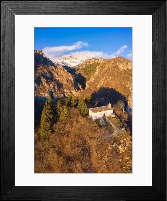 Framed Print : Aerial view of the small church called San Peder and the Presolana during a winter sunset Framed Print : Aerial view of the small church called San Peder and the Presolana during a winter sunset