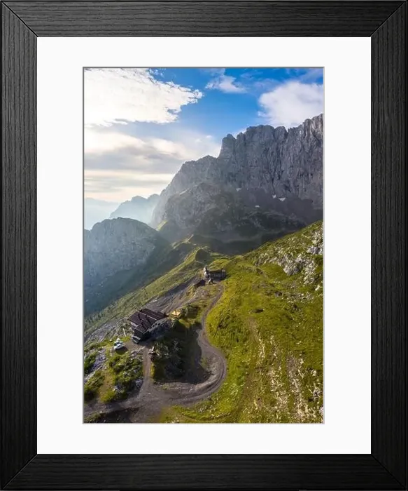 Framed Print : Aerial view of the old huts of the miners and the north face of the Presolana at dawn Framed Print : Aerial view of the old huts of the miners and the north face of the Presolana at dawn