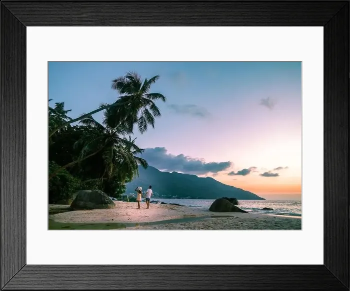 Framed Print : couple walking on tropical beach Mahe Seychelles during sunset Framed Print : couple walking on tropical beach Mahe Seychelles during sunset