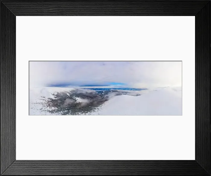 Framed Print : Aerial view of the stunning winter panorama of the snowy slopes and hills among the lush white clouds Framed Print : Aerial view of the stunning winter panorama of the snowy slopes and hills among the lush white clouds