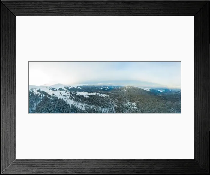 Framed Print : Aerial view of the stunning winter panorama of the snowy slopes and hills among the lush white clouds Framed Print : Aerial view of the stunning winter panorama of the snowy slopes and hills among the lush white clouds