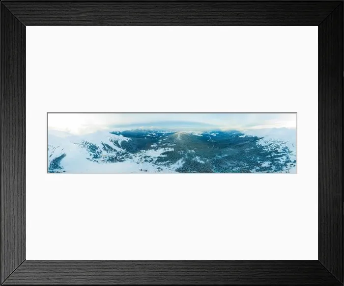 Framed Print : Aerial view of the stunning winter panorama of the snowy slopes and hills among the lush white clouds Framed Print : Aerial view of the stunning winter panorama of the snowy slopes and hills among the lush white clouds