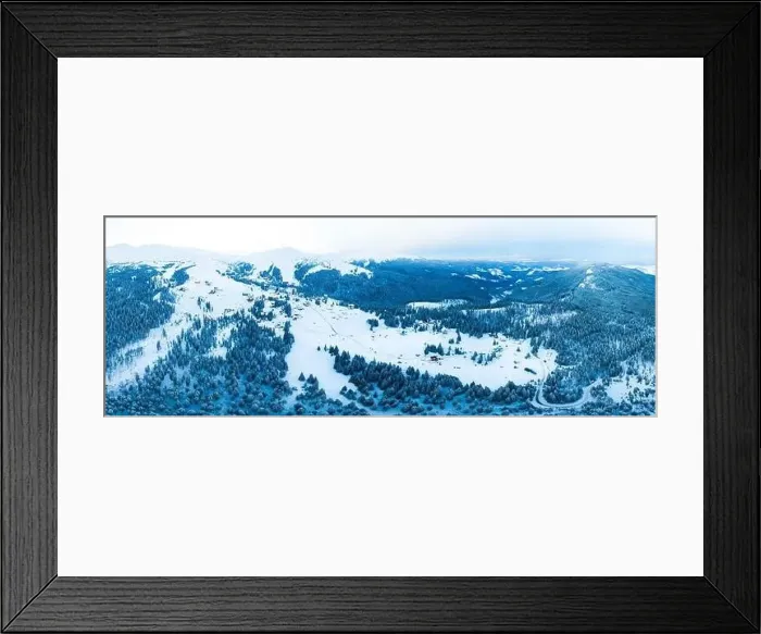 Framed Print : Magical panorama of a beautiful hill in the mountains covered by snow on the ski slope on a sunny day with a clear blue Framed Print : Magical panorama of a beautiful hill in the mountains covered by snow on the ski slope on a sunny day with a clear blue