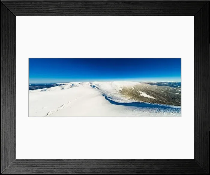 Framed Print : Magical panorama of a beautiful hill in the mountains covered by snow on the ski slope on a sunny day with a clear blue Framed Print : Magical panorama of a beautiful hill in the mountains covered by snow on the ski slope on a sunny day with a clear blue