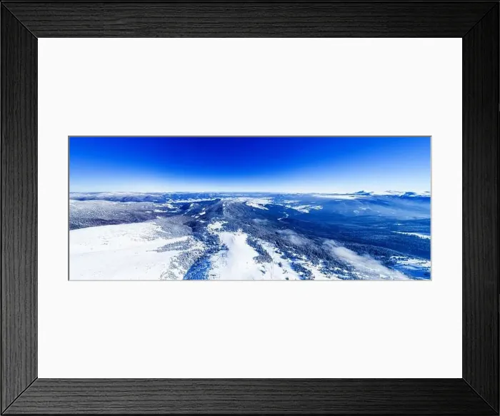 Framed Print : Magical panorama of a beautiful hill in the mountains covered by snow on the ski slope on a sunny day with a clear blue Framed Print : Magical panorama of a beautiful hill in the mountains covered by snow on the ski slope on a sunny day with a clear blue