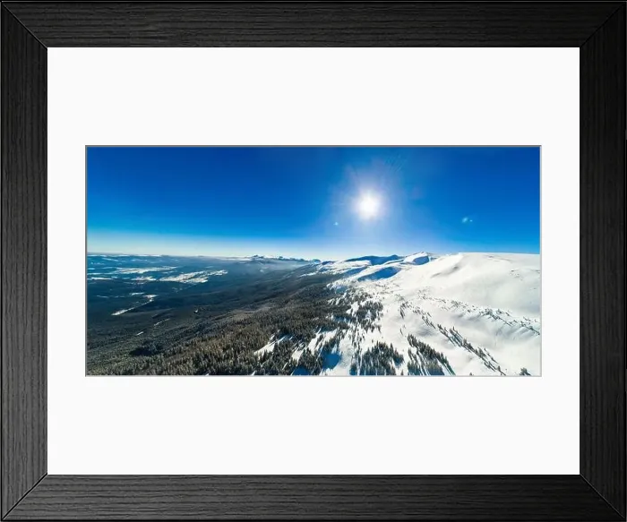 Framed Print : Aerial view of an amazing mesmerizing view of a mountain winter landscape on a sunny frosty day at a ski resort Framed Print : Aerial view of an amazing mesmerizing view of a mountain winter landscape on a sunny frosty day at a ski resort