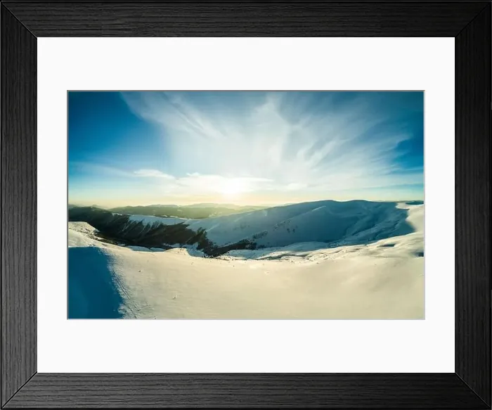 Framed Print : Top view of an unforgettable ski slope covered with snow located in the mountains in the northern country on a sunny Framed Print : Top view of an unforgettable ski slope covered with snow located in the mountains in the northern country on a sunny