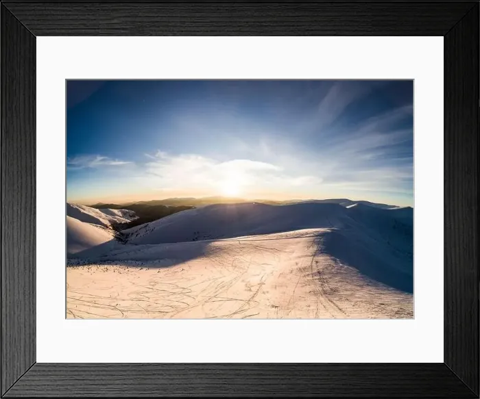 Framed Print : Top view of a beautiful mesmerizing view of the ski slope with ski trails located in the mountains on a sunny winter