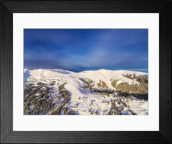 Framed Print : Aerial view of beautiful winter mountain slopes covered with snow and firs forest on a sunny cloudless day Framed Print : Aerial view of beautiful winter mountain slopes covered with snow and firs forest on a sunny cloudless day
