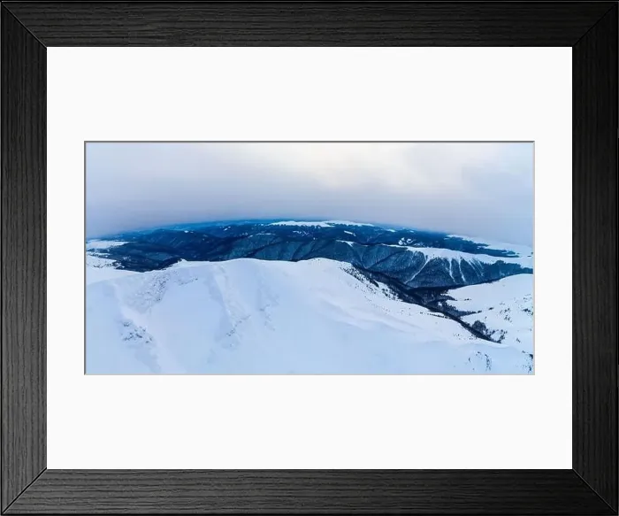 Framed Print : Stunning view of the cliffs covered with snow and trees on a cloudy winter day at the ski resort Framed Print : Stunning view of the cliffs covered with snow and trees on a cloudy winter day at the ski resort