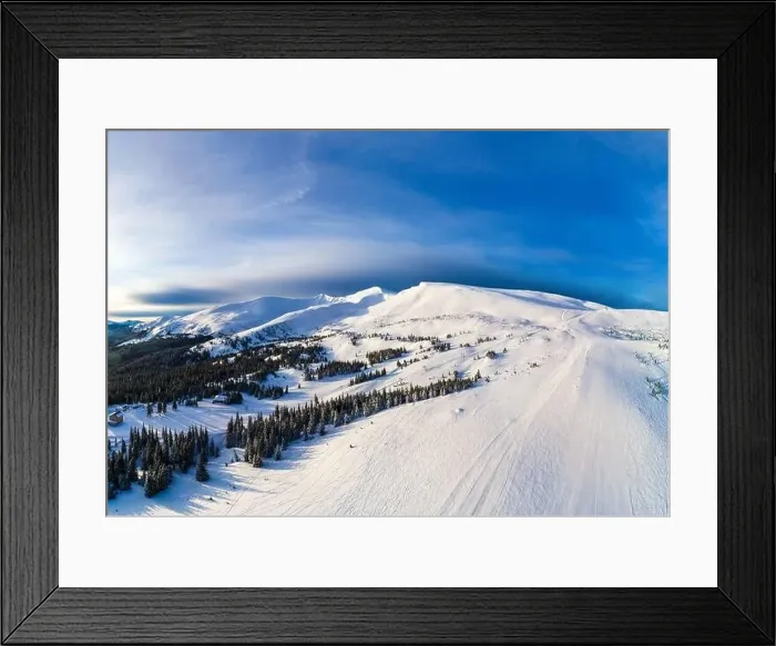 Framed Print : Aerial view of beautiful winter mountain slopes covered with snow and firs forest on a sunny cloudless day Framed Print : Aerial view of beautiful winter mountain slopes covered with snow and firs forest on a sunny cloudless day