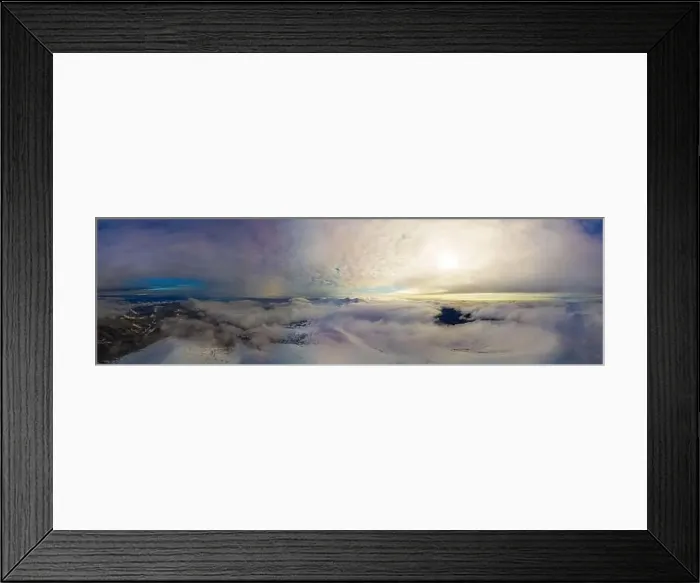 Framed Print : Aerial view of the stunning winter panorama of the snowy slopes and hills among the lush white clouds Framed Print : Aerial view of the stunning winter panorama of the snowy slopes and hills among the lush white clouds