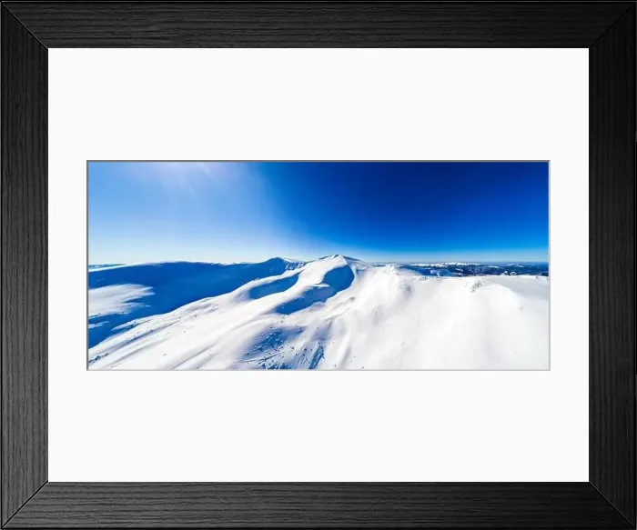 Framed Print : Magical panorama of a beautiful hill in the mountains covered by snow on the ski slope on a sunny day with a clear blue Framed Print : Magical panorama of a beautiful hill in the mountains covered by snow on the ski slope on a sunny day with a clear blue