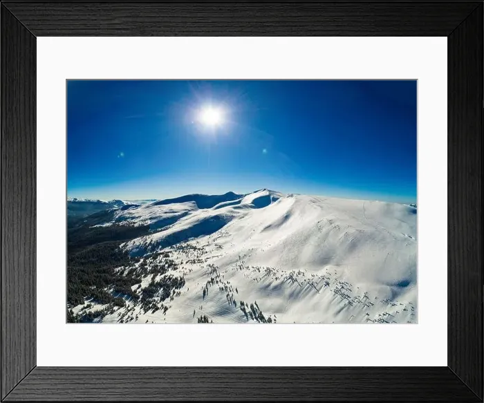 Framed Print : Fabulous view of the sunny winter slope with snowy trees located in the ski resort Framed Print : Fabulous view of the sunny winter slope with snowy trees located in the ski resort
