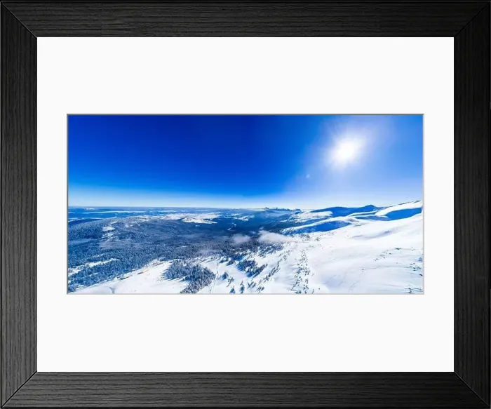 Framed Print : Magical panorama of a beautiful hill in the mountains covered by snow on the ski slope on a sunny day with a clear blue Framed Print : Magical panorama of a beautiful hill in the mountains covered by snow on the ski slope on a sunny day with a clear blue